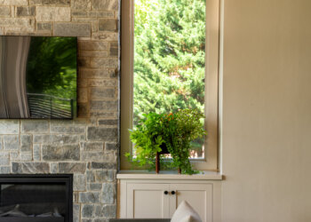 Stone fireplace detail in the open-air covered porch