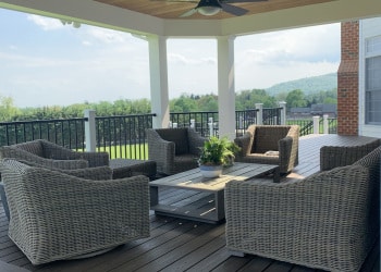 Outdoor seating area beneath a covered porch.