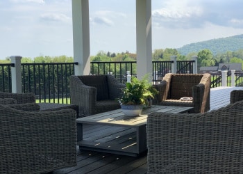Custom porch seating area overlooking the landscape.
