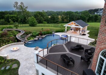 Elevated twilight view of the pool waterslide terrace and pavilion