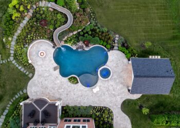 Overhead view of the freeform pool waterslide spa and pool house landscape