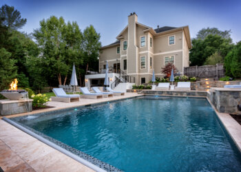 Pool and spa terrace with a fire bowl and tailored lounge seating