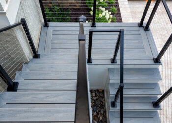 Portrait view of the terrace stairs pool edge and contemporary cable railing