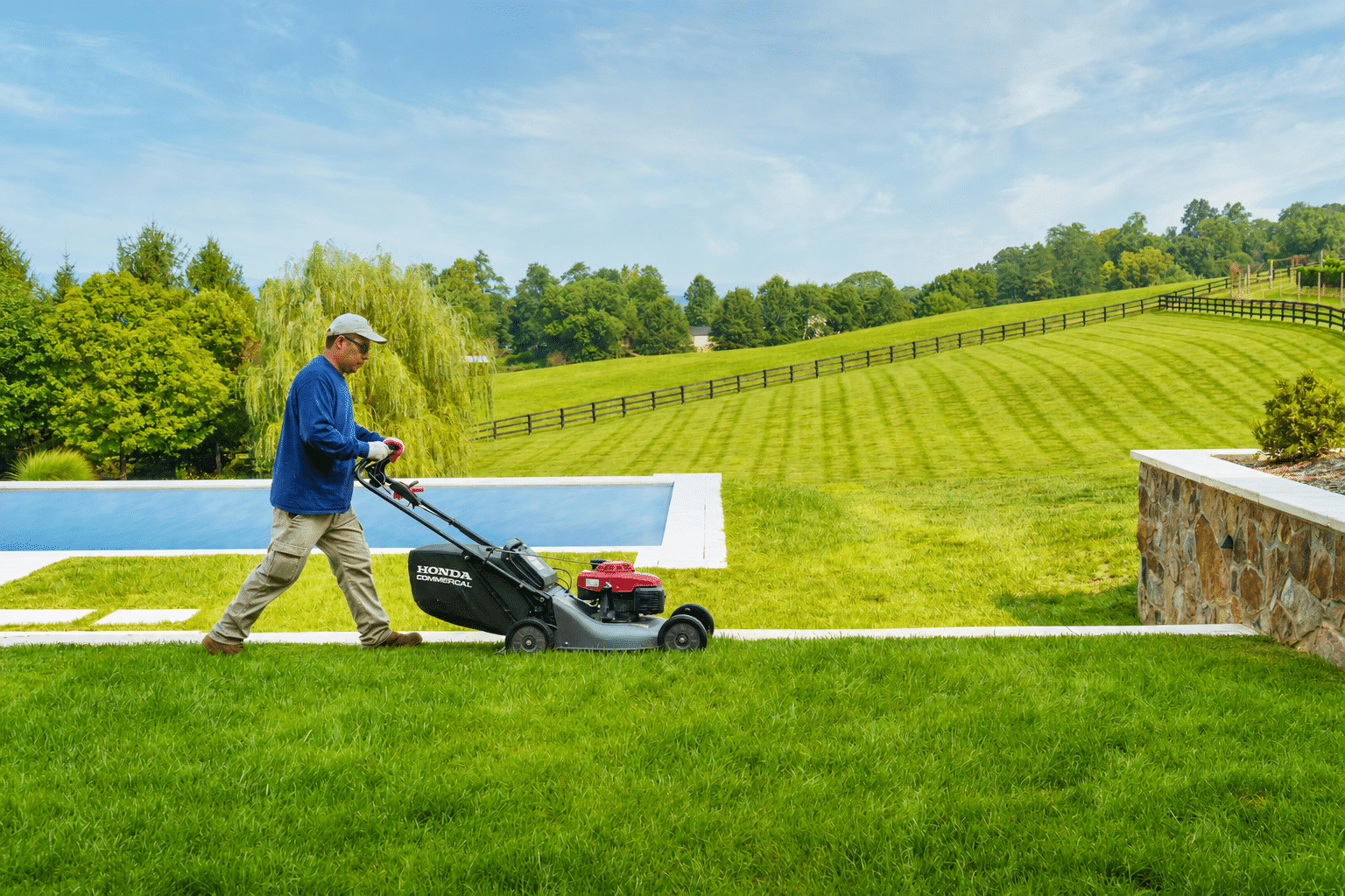 C&P crew member maintaining estate grounds