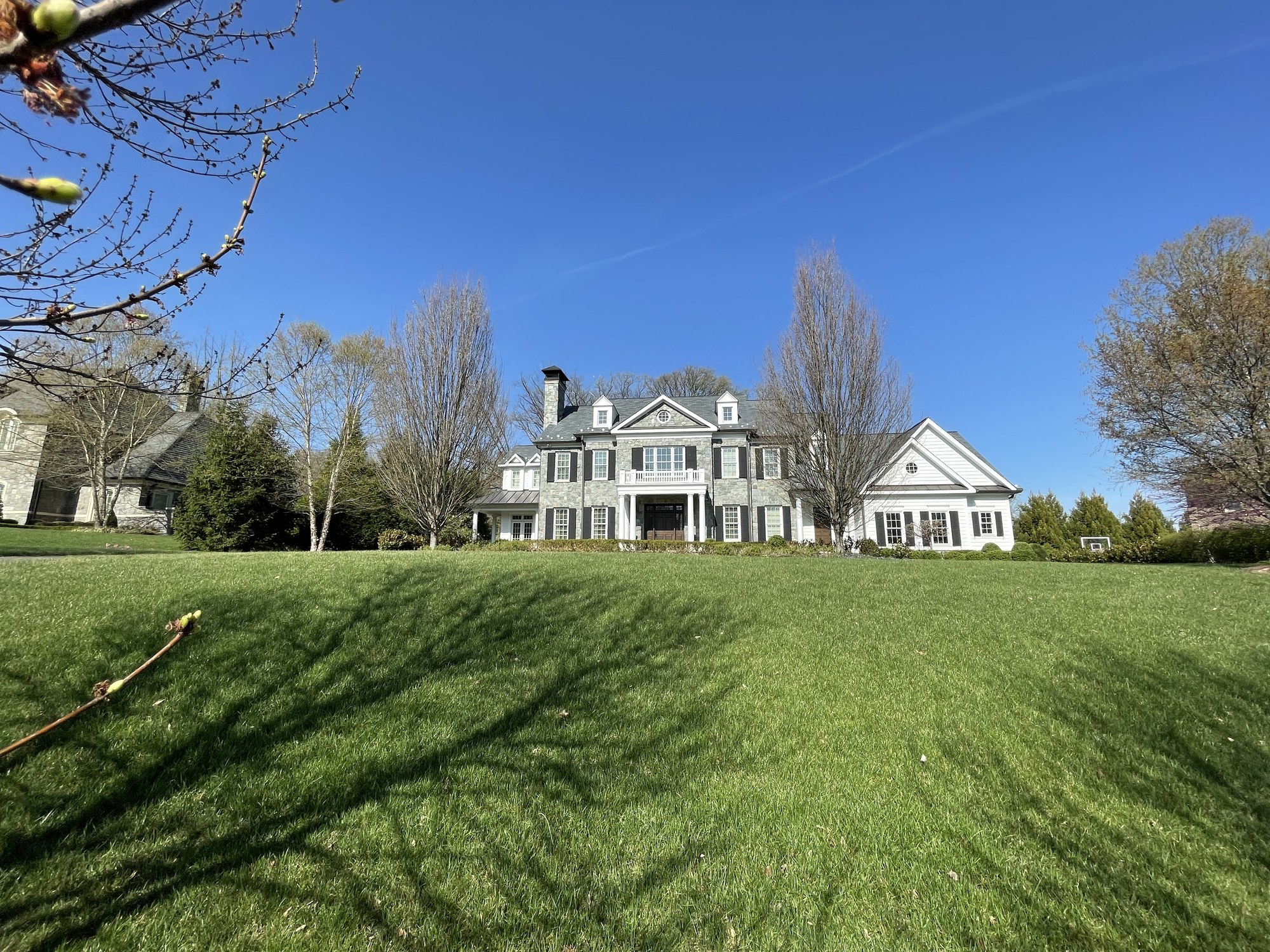 Estate lawn and residence during property care walk