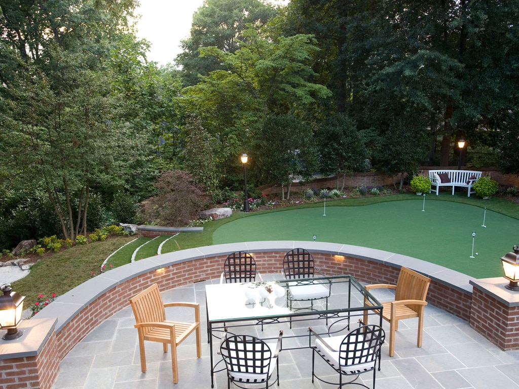 Dining patio overlooking a residential putting green