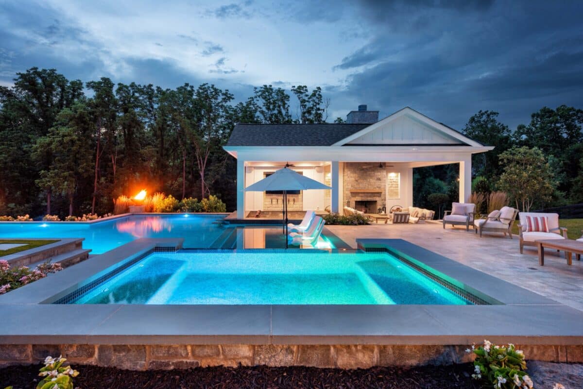 Pool, spa, pavilion, and fire feature at Waterford Creek Resort at dusk